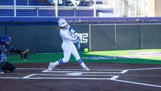 Maci Cole swings the bat