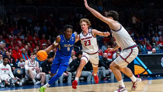 Ade Popoola looks to drive against New Mexico