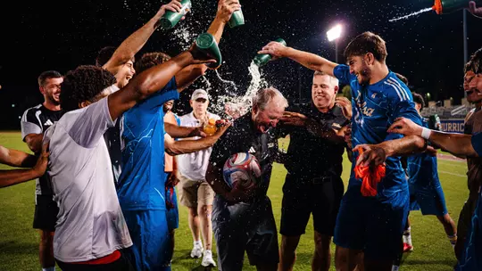 Coach McIntosh 300 win celebration