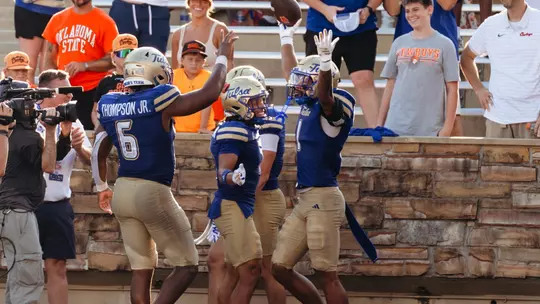 Zach Williams celebrates an interception against Oklahoma State