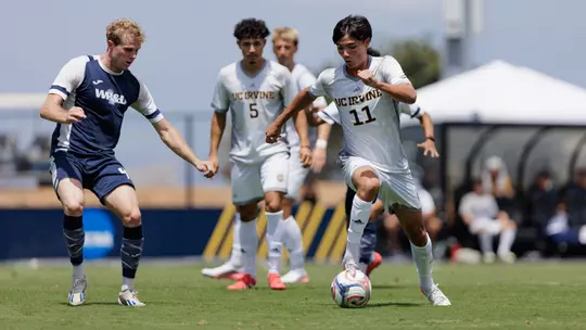 Gage Lyons dribbles through the defense in a 2026 exhibition match