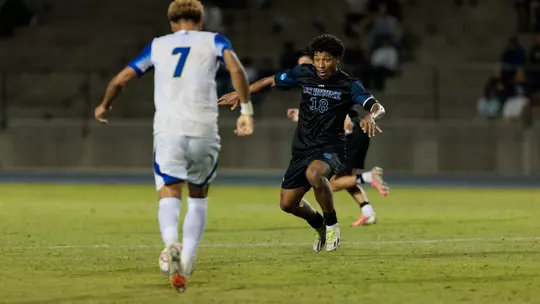 Isaac Powell defends against UC Santa Barbara in their 2026 match in Anteater Stadium