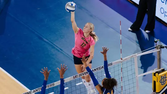 Bird's eye view of Madison Triplett making contact with the ball on an attack from the pin in an NCAA women's volleyball match.