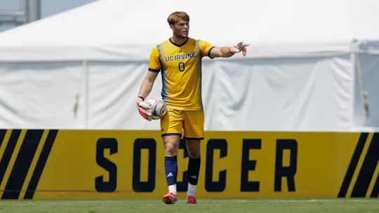 Scott Williams sets the play up in a men's soccer exhibition in 2026