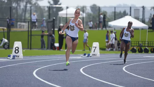 Esmeray Demirbas running on the track at Anteater Stadium