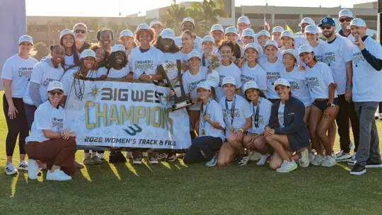 UC Irvine UC Irvine women's track and field poses with the trophy and Big West Championship banner