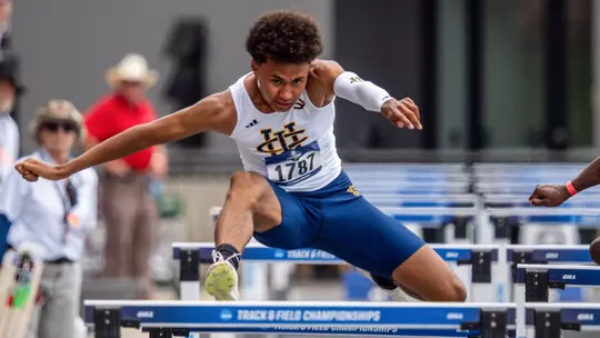 Logan Lyght goes over a barrier in the 110 hurdle race at the NCAA West First Round