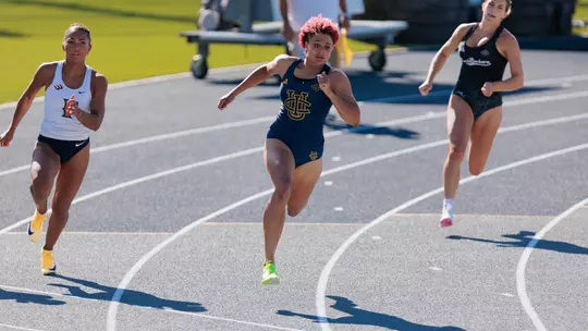 Joy Anderson sprinting the turn of the 200