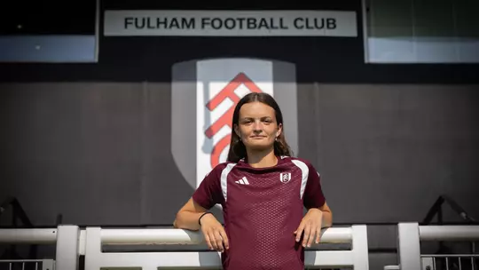 Women's soccer alum Sophie Gillies poses following her signing with Fulham FC