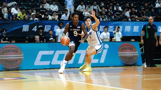 Jovan Jester Jr. drives around a Chinese Taipei White defender during their opener of the 2026 William Jones Cup in New Taipei City