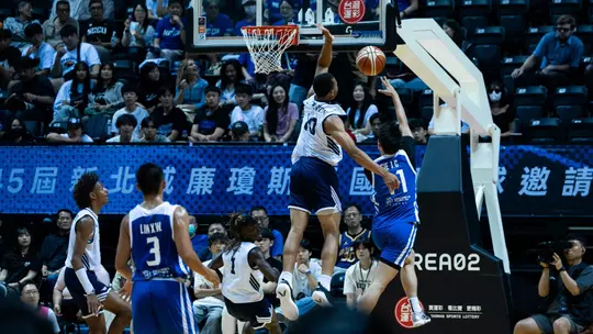 Josiah Johnson goes up for a block vs. Chinese Taipei White in the 2026 William Jones Cup