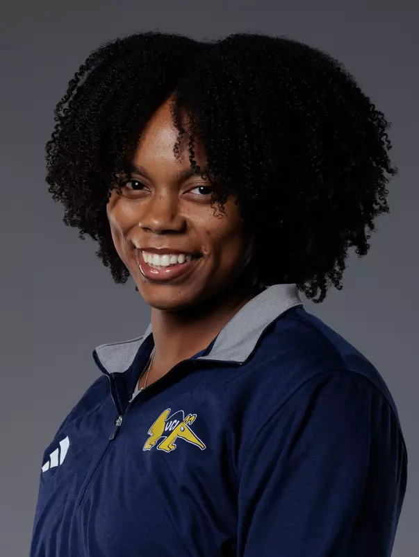 Head shot of Gail Usher in a blue quarter zip with the BC Anteater logo.