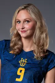 Head shot of Lois Hansen wearing a blue uniform with yellow UCI stack logo and number 9.