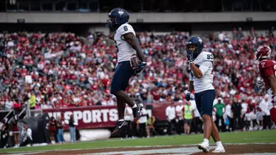 HUSKIES GO ON THE ROAD AND BEAT TEMPLE