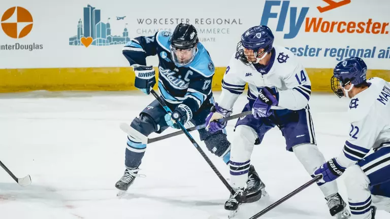 Owen Fowler battles for the puck.