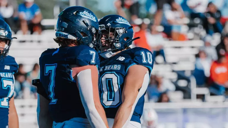 Sam Oppenheimer and Noah Carpenter celebrate a sack