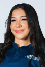 Headshot of women's swimmer wearing blue polo