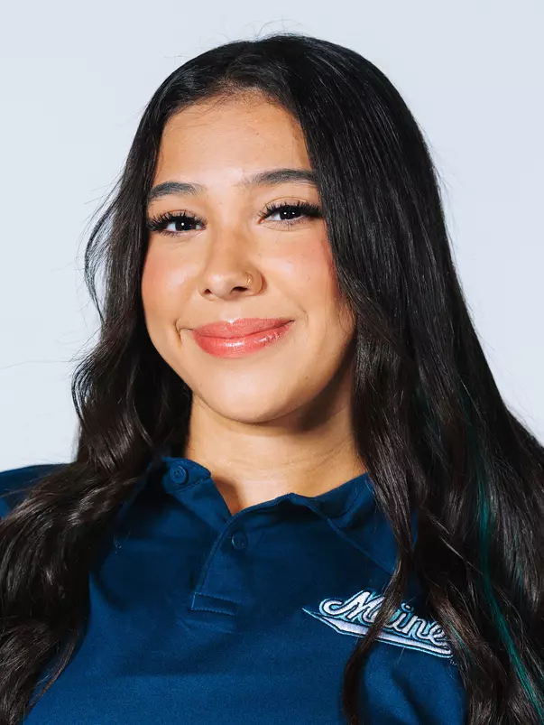 Headshot of women's swimmer wearing blue polo