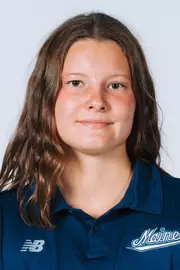 Headshot of women's swimmer wearing blue polo