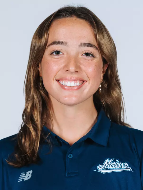 Headshot of women's swimmer wearing blue polo