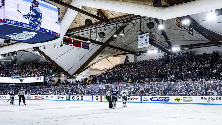 Wide shot of Alfond Arena during a game, with a full crwod.