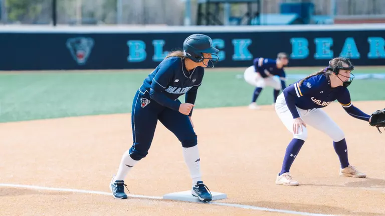 Madison Hand gets ready to run on third base.