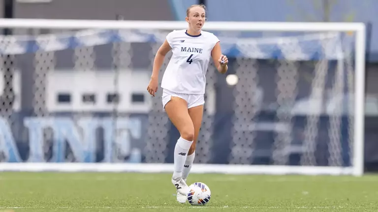 Meghan Bernetti dribbles the ball up the field.