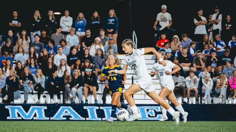 Hannah Wehmeyer dribbles the ball up the field.