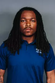 2026 Maine football roster head shot. Blue polo with Maine script.