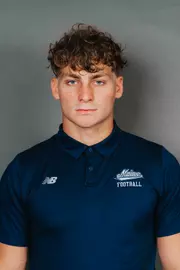 2026 Maine football roster head shot. Blue polo with Maine script.