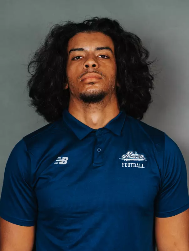 2026 Maine football roster head shot. Blue polo with Maine script.