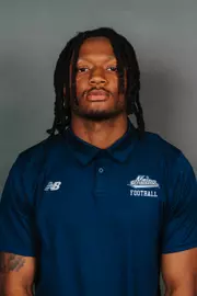 2026 Maine football roster head shot. Blue polo with Maine script.