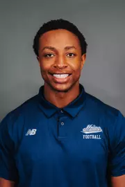 2026 Maine football roster head shot. Blue polo with Maine script.