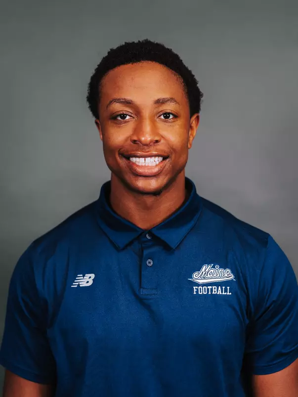 2026 Maine football roster head shot. Blue polo with Maine script.