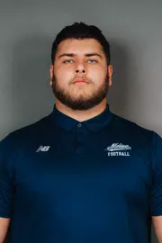 2026 Maine football roster head shot. Blue polo with Maine script.