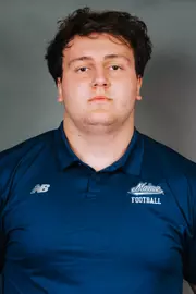 2026 Maine football roster head shot. Blue polo with Maine script.