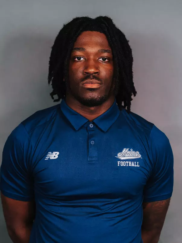 2026 Maine football roster head shot. Blue polo with Maine script.