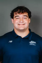 2026 Maine football roster head shot. Blue polo with Maine script.
