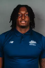 2026 Maine football roster head shot. Blue polo with Maine script.