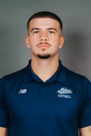 2026 Maine football roster head shot. Blue polo with Maine script.