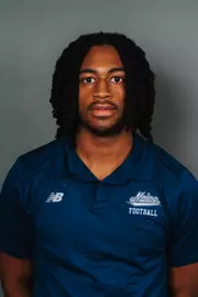 2026 Maine football roster head shot. Blue polo with Maine script.