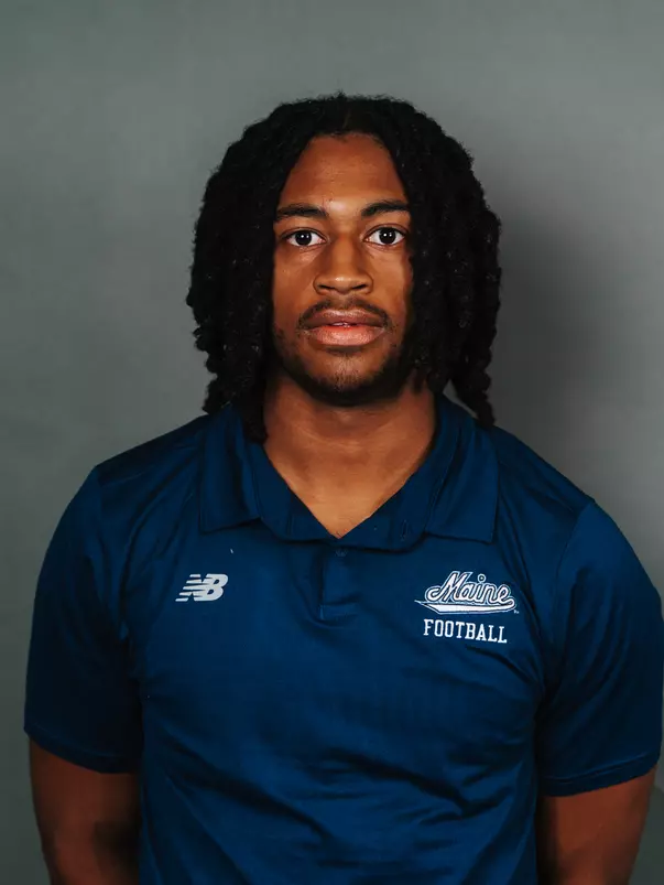 2026 Maine football roster head shot. Blue polo with Maine script.