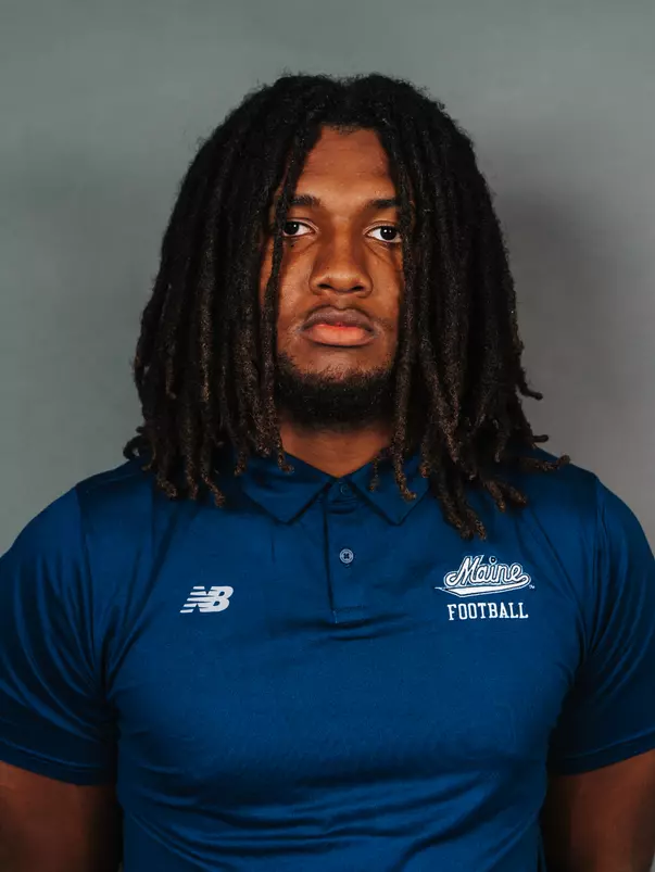 2026 Maine football roster head shot. Blue polo with Maine script.