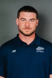 2026 Maine football roster head shot. Blue polo with Maine script.