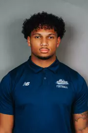 2026 Maine football roster head shot. Blue polo with Maine script.