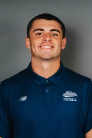 2026 Maine football roster head shot. Blue polo with Maine script.