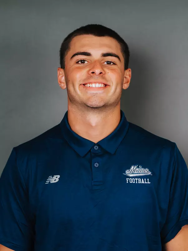 2026 Maine football roster head shot. Blue polo with Maine script.