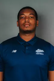 2026 Maine football roster head shot. Blue polo with Maine script.