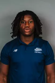 2026 Maine football roster head shot. Blue polo with Maine script.