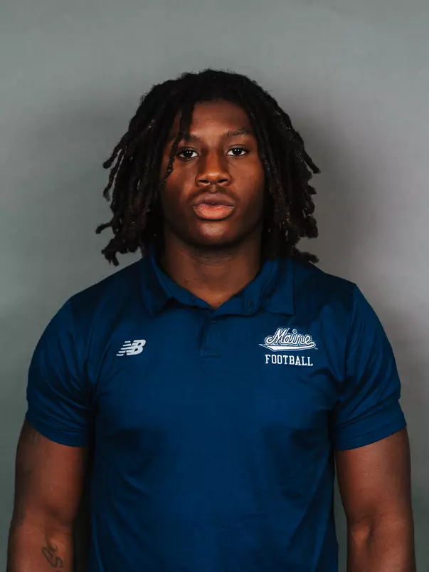 2026 Maine football roster head shot. Blue polo with Maine script.